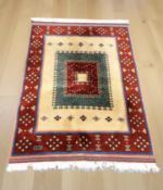 A North African geometric woolen rug, 213 cm x 139 cm.