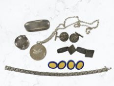 A group of silver and white metal items including a pair of enamelled cuff links, pill box,