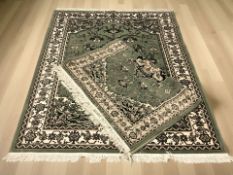 Two rugs of Iranian design on green ground largest 232 cm x 170 cm