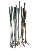 A group of vintage and later golf clubs including several hickory-shafted examples