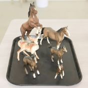 A group of ceramic horse figures including Beswick,