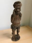 An African carved wooden figure of a man,
