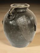 An Oriental bronze vase with ring handles,