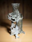 A Chinese bronze spill vase in the form of a man on horseback under a tree,