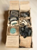 Six vintage gas masks in boxes