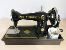 An antique Singer hand sewing machine