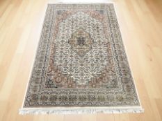 A Tabriz rug 223 cm x 145 cm