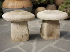 A pair of concrete garden staddle stones,