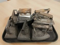 A group of antique irons