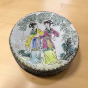 A white metal and porcelain inset circular box,