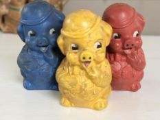Three vintage plastic piggy banks,