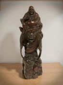 A Chinese carved hardwood statue of Buddha,