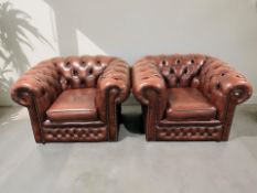 A pair of Chesterfield Oxblood buttoned leather club armchairs,
