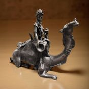 An African bronze figure of a man on camel,