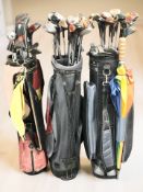 Three golf bags containing vintage and later irons and drivers