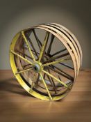 A set of four painted metal cart wheels,