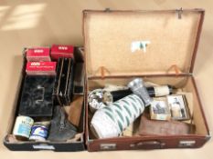 A vintage luggage case and further box of enamel oxo tins, coins, cigarette cards, pottery vase,