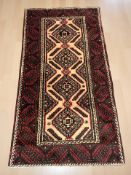 A Balouch rug 191 cm x 104 cm