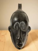An African carved hardwood wall mask,