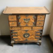 An Oriental lacquered elm altar cabinet,