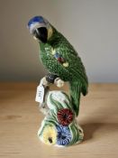 A Portuguese pottery figure parrot,
