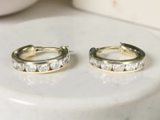 A pair of 9ct gold cubic zirconia hoop earrings CONDITION REPORT: 2.