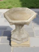 A hexagonal concrete garden pedestal bird bath height 42 cm