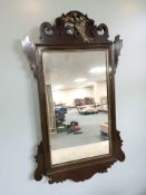 A George III style mahogany and parcel gilt framed mirror,