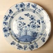 An 18th century Delft tin glazed pancake plate,