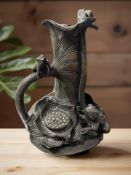 A Chinese bronze spill vase, in the form on frogs on a plant,