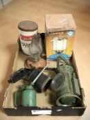 A group of vintage oil lamps, oil can,