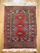 A Lahore Bokhara rug 97 cm x 64 cm