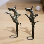 A pair of West African bronze statues of figures on horseback,