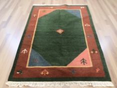 An Eastern fringed woolen rug,