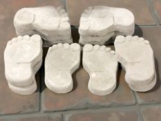 A set of twelve concrete garden feet paving stones,