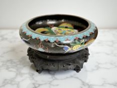 A Japanese Cloisonne bowl on wooden stand,