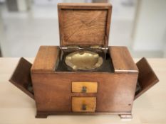 A cigarette dispenser with central ashtray,