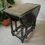 A 19th century carved oak gateleg table,