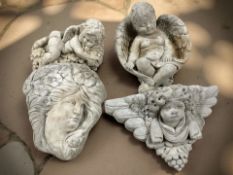 A concrete cherub garden wall pocket, width 39 cm,
