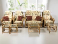 A wicker eight piece conservatory suite comprising two seater settee,