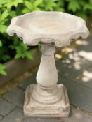 An octagonal concrete garden bird bath height 65 cm