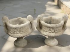 A pair of twin handled garden urn planters,
