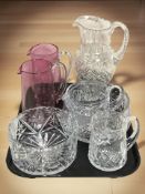 Two cranberry glass waterjugs,