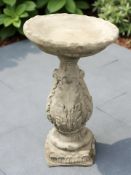 A circular concrete acanthus leaf patterned bird bath height 62 cm