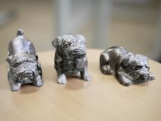 Three cast bronze figures of bulldogs,