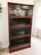 A reproduction glazed four-height bookcase,