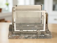 A pair of chrome and marble Art Deco picture frames,