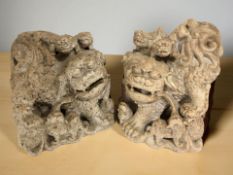A pair of Oriental carved soapstone foo dogs,