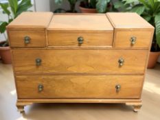 An Art Deco walnut five drawer chest,