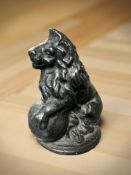 A Victorian cast iron figure of a seated Lion, height 11.